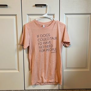 Pink T-shirt. “If dogs could talk I’d have no need for people”